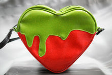 Load image into Gallery viewer, large Poisonous heart bag is made with red glitter and Green Goo. Photo of the back of the bag. 