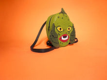 Load image into Gallery viewer, swamp monster backpack on orange background