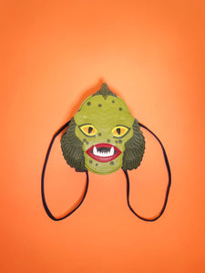 swamp monster backpack on orange background